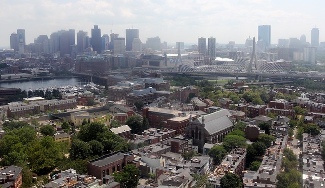 The view of Boston through the dirty window atop the Bunker Hill monument