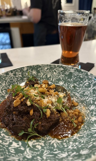 Birria over a potato cake. Paired with an Irish Red Ale