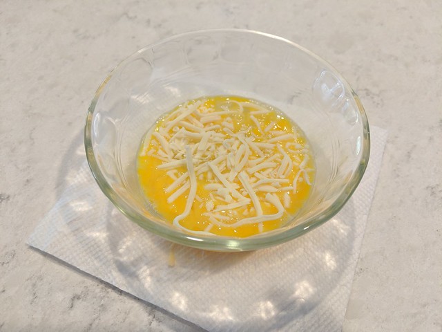 Add a bit of cheese and stick this thing in the microwave for ~45 seconds. Time depends on both m...