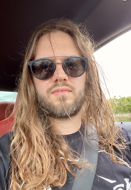 Windows: down. Hair: tangled.
