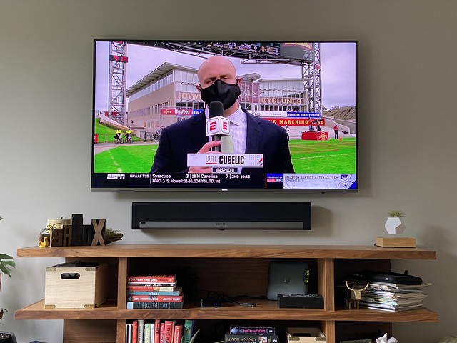 Masked up football commentator