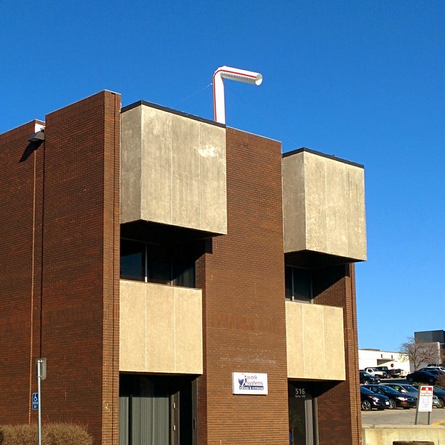 This building has a dang straw coming out the top!