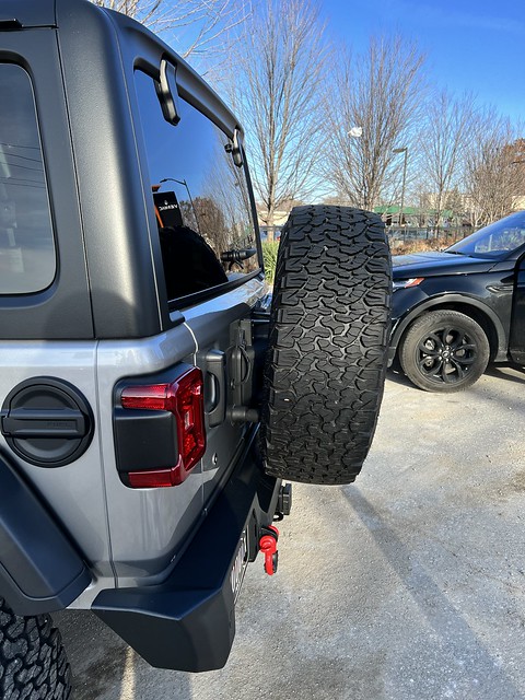 Just got rear-ended. Tire carrier is broken, tailgate is dented. Spare wheel is scratched. Bumper is pushed in.