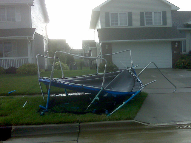 It flew from the back yard of that yellow house, slammed into the house on the left, and landed in the street.