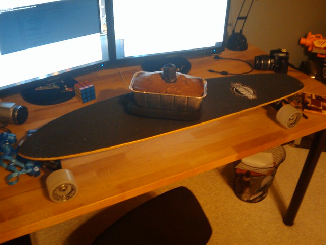Kari just presented me with birthday zucchini bread on a birthday longboard!