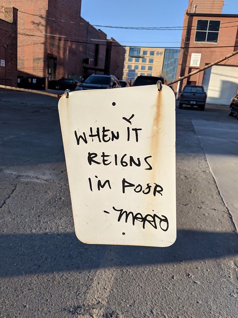 I like this little tag on the back of this sign. When it reigns I'm poor. - Mario