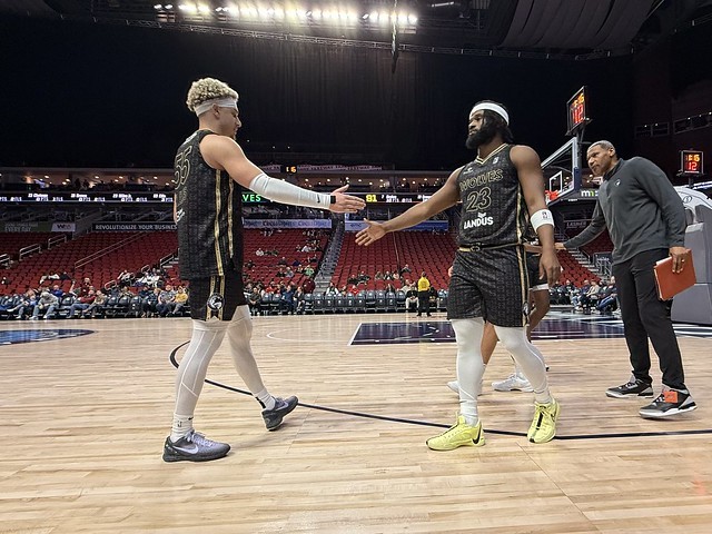 Walter Ellis and Miles Jr, slapping hands