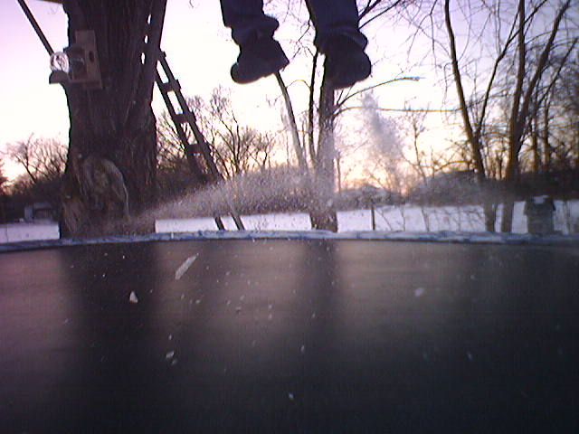 Trampoline and snow flying