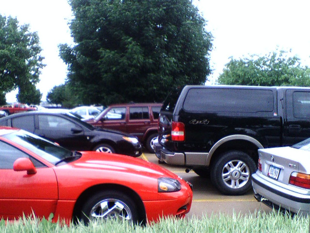 Sweet parking by the maroon Jeep