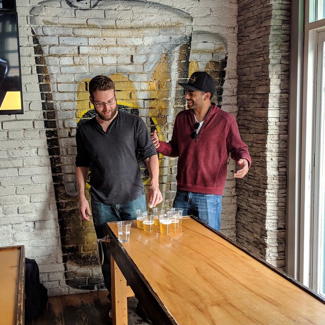 A random after-work game of beer pong with these dudes