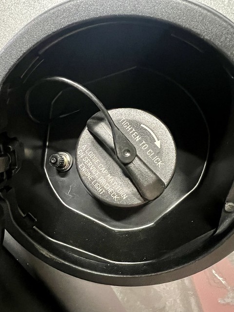 Schrader valve for the bags under the fuel door