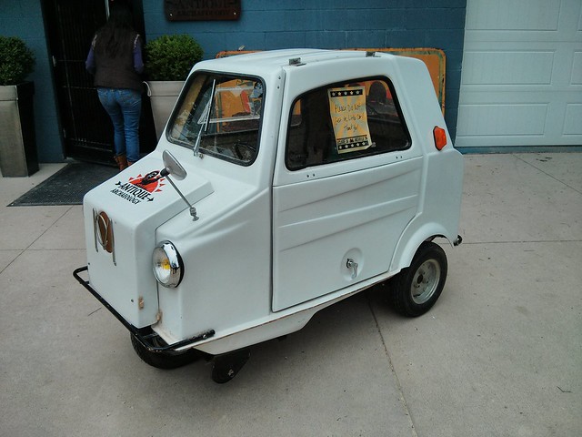A tiny three wheeled car