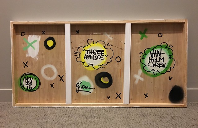 Tags on the back of a piece of art from Van Holmgren