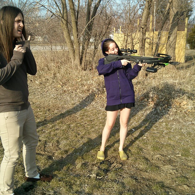 Celeste shooting the crossbow