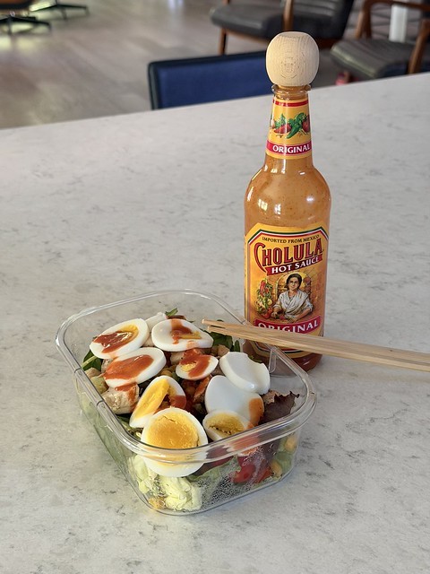 Cholula is the dressing. Chopsticks are the utensil.