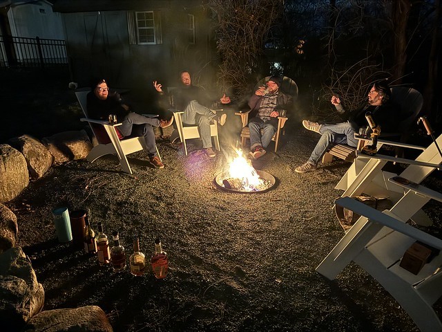 Whiskey, cigars, friends, and a fire