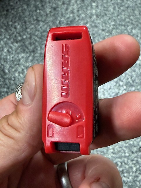 A cute little spare battery cover design by SRAM