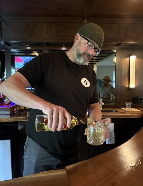 Cullen pours some Malört on the rocks