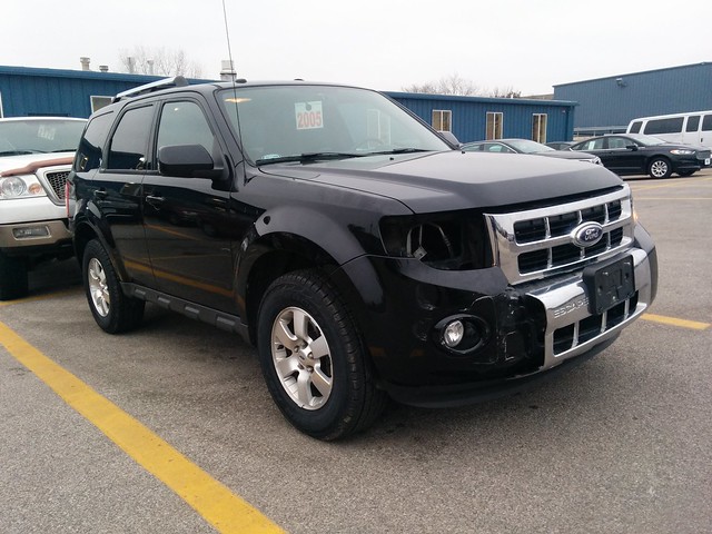 Kari's totaled SUV, after deeply assessing the damage.