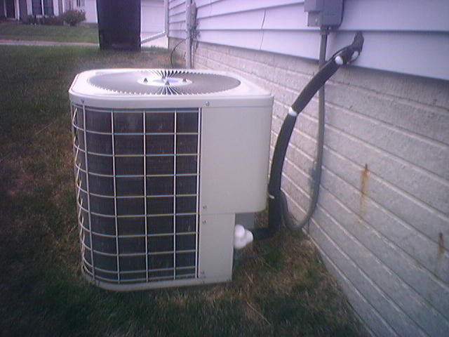 Overworked A/C - notice the ice buildup all over the hose, haha.