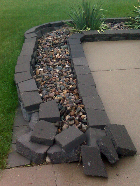 Trent ran into my landscaping.  I've gotta reset that front wall all the way around the corner.  ...
