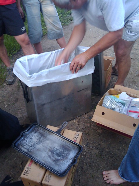 Packin up food and equipment.