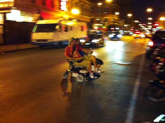These dudes were doing donuts in the middle of the street on a motorized wheelchair while waving bottles of liquor in the air.