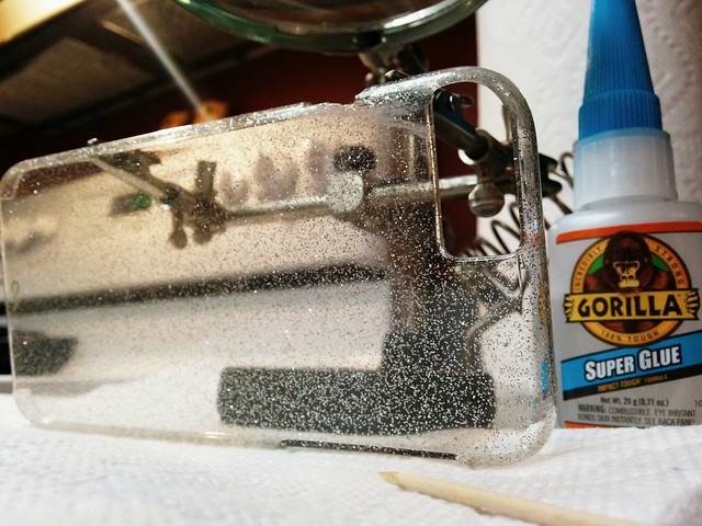 Repairing the $40 glitter case for her 1 week old gold iPhone 6 that just met the pavement...