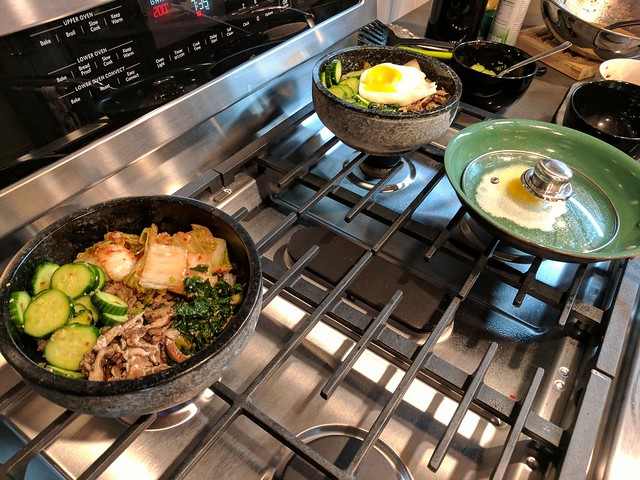 Puttin together some Bibimbap in these hot stone bowls.