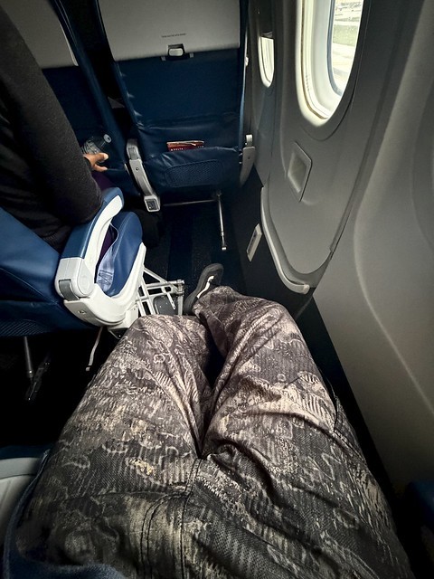 Taking off for Detroit very late… but at least I’ve got leg room.