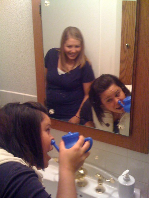 Tia trying out (and hating) the Neti Pot.