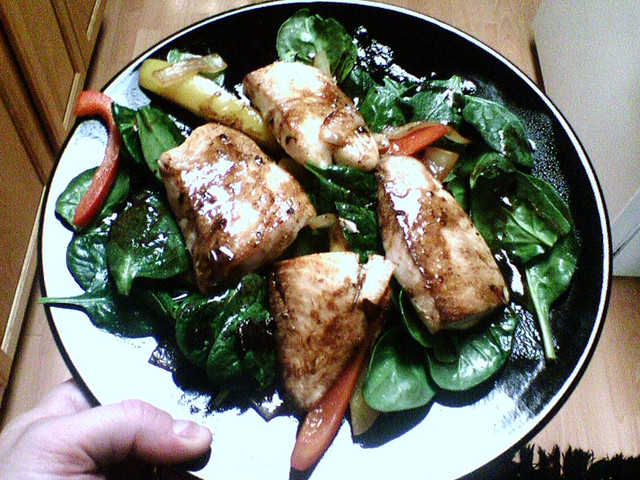 Tilapia over spinach, onion, and peppers with balsamic vinegar