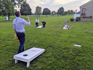 Throwing bags with your son on the board