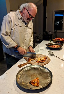 pizza - Jeff cuttin off a slice