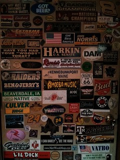 Stickerbombed door at Alpine Tap