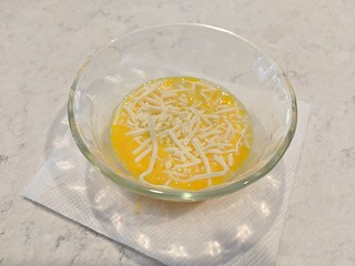 Add a bit of cheese and stick this thing in the microwave for ~45 seconds. Time depends on both microwave and dish type.