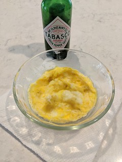 Take the egg out of the microwave and add Tabasco, or salt and pepper, or Cholula, or whatever sounds good that day.