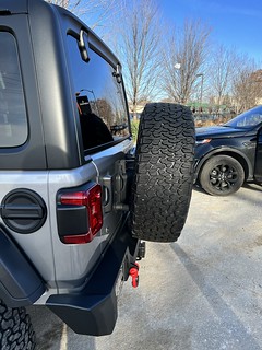 Just got rear-ended. Tire carrier is broken, tailgate is dented. Spare wheel is scratched. Bumper is pushed in.