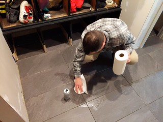 Jeff checks out my freshly laid tile. Immediately spills his soda on it.