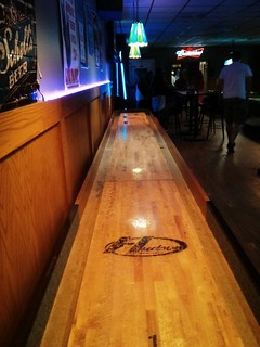 Playin shuffleboard at city and country tavern