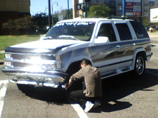 Hacksawing his bumper off