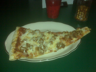 pizza - A huge piece of pizza at Corigliano's Underground