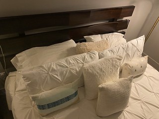 Why does a bed need to have this many pillows?