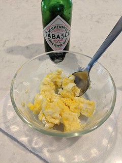 Chop that egg up with a spoon and eat it.