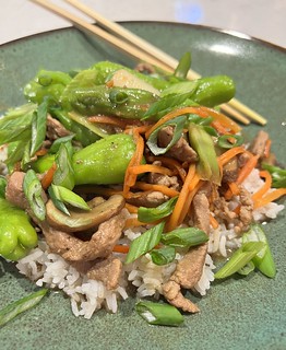 Pork chop suey with a lot of shishitos