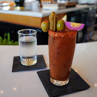 Drinks - A bloody mary prepared by a bartender. And look at that pickled egg.