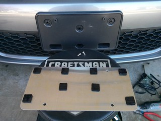 Drilled out the awful front license plate holes, added some well nuts and velcro
