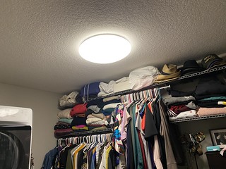 I mounted this light in our closet. It's a rather non-descript, dimmable cloud light. Kari is pissed about it. Before this went up, we had a bulb hanging from wires in the ceiling.