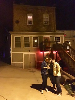 Take our picture behind this old apartment