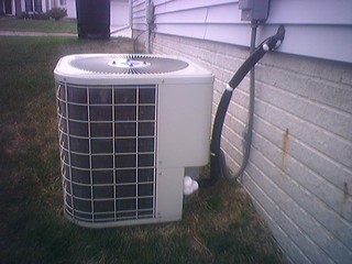 House - Overworked A/C - notice the ice buildup all over the hose, haha.